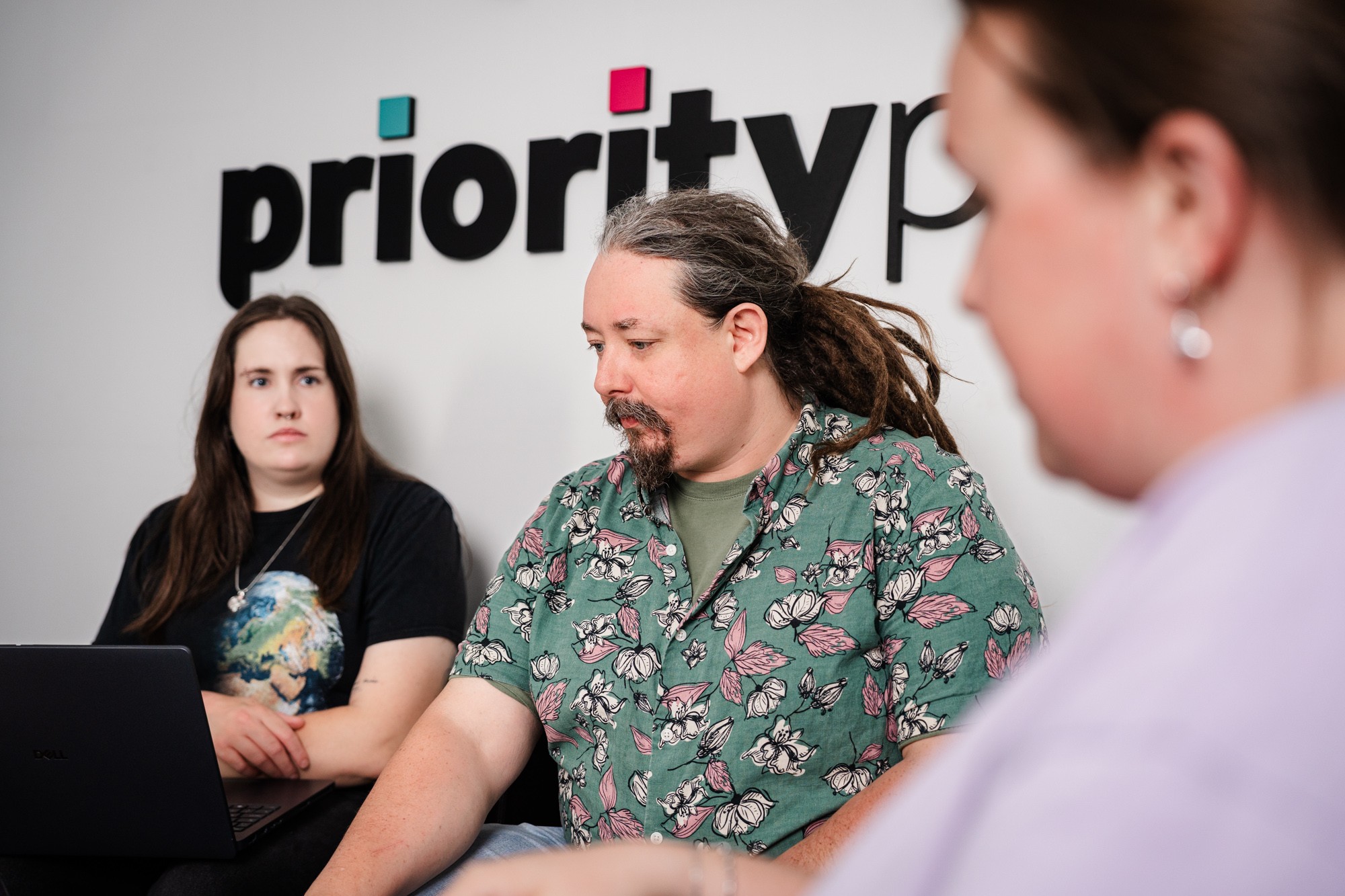 Priority Pixels AI search team discussing SXO strategy